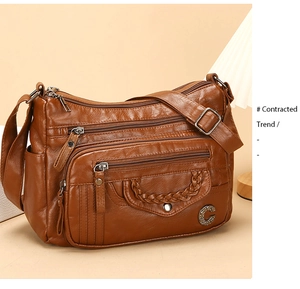 Brown faux leather crossbody bag with multiple zip pockets and woven texture detail