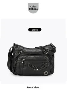 Close-up of black crossbody bag with textured leather, zip pockets and woven detail