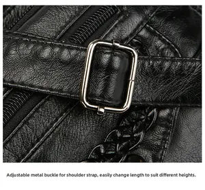 Detail of adjustable silver buckle and soft pleated leather texture on black crossbody bag