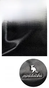 Macro texture of black litchi pattern leather with waterproof and durable coating