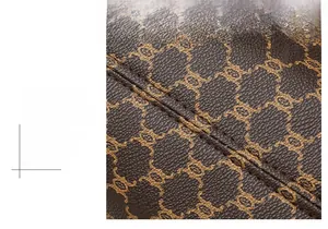 Detail of precise stitching on premium brown vintage PU leather tote with logo pattern
