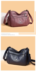Detail of multi-pocket crossbody bags in burgundy and navy with three zipper compartments