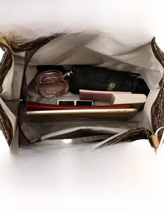 Interior view showing large capacity and compartments of brown PU leather tote bag