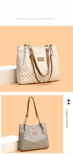 Detail view of vintage patterned tote bags with chain straps in beige and grey soft PU leather