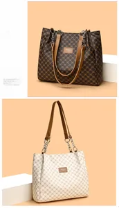 Detail of vintage tote bags with printed PU leather, soft texture and metal chain handles