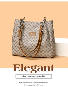 Close-up of vintage geometric pattern tote bag with brown leather trim and chain straps