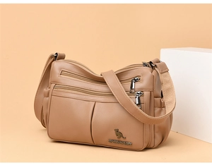 Close-up of litchi texture leather crossbody bag with multi-layer zipper pockets