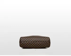 Close-up of the vintage brown monogram pattern canvas bottom on large tote bag