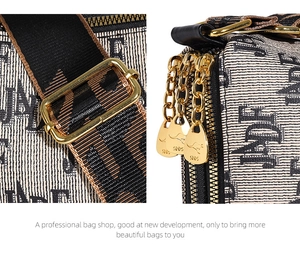 Close-up of adjustable striped strap and gold dual zippers with kangaroo logo detail
