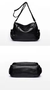 Macro shot showing the back exterior and wide base of the black pebbled leather handbag