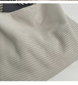 Macro shot of soft ribbed corduroy fabric texture on a casual tote bag for students
