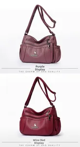 Detail view of purple and wine red PU leather handbags showing zippers and brand logo