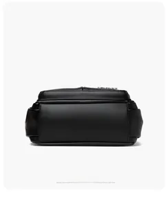 Detail view of reinforced stitching on the flat base of a black leather crossbody bag