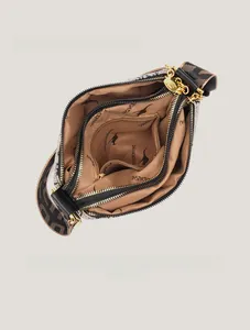 Detail view of multi-compartment interior with brand lining and smooth metal zippers