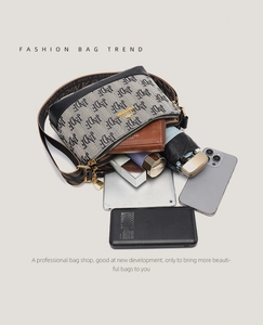 Detail showing high-capacity interior of letter print shoulder bag with daily essentials