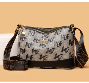 Black leather crossbody bag featuring JADF monogram print and golden kangaroo logo