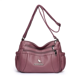 Dusty pink faux leather crossbody bag with lychee texture and multiple zipper pockets