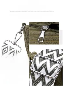 Close-up of polished silver hardware and dark green corduroy fabric on a tote bag