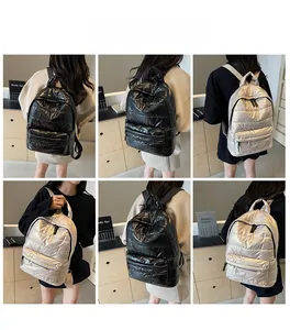 Quilted puffer backpack for women in black and silver shown from multiple side angles