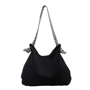 Large black corduroy hobo bag with trendy black and white woven shoulder strap