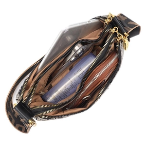 Large soft leather shoulder bag with wide retro strap showing spacious multi-compartments