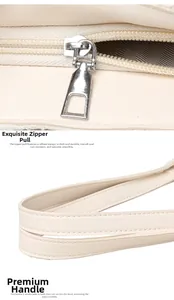 Détail de la fermeture éclair argentée et coutures de ce sac fourre-tout ivoire