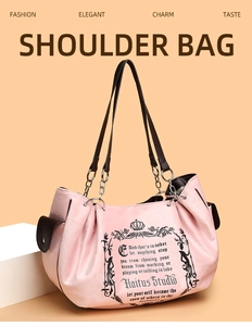 Detail of pink vintage tote bag with contrast brown pockets and silver chain shoulder strap