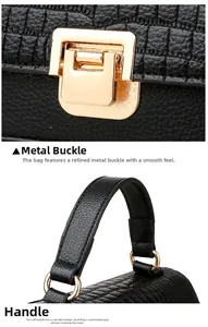 Detail of gold metal buckle and crocodile pattern handle on black leather tote bag