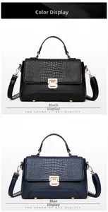 Detail of crocodile embossed leather handbag with gold twist lock and adjustable strap
