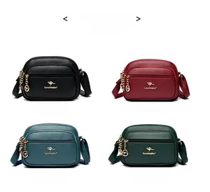 Detail view of mini crossbody bags in four colors with textured leather and gold kangaroo logo