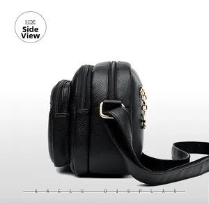Side view showing multi-zipper structure and litchi texture of the black crossbody bag