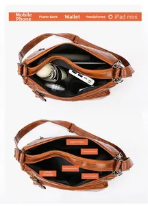 Interior view of brown faux leather shoulder bag showing multi-compartment storage space