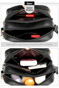 Detail view of black litchi pattern bag showing multi-layer compartments and zip pockets