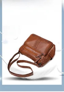 Brown soft leather multi-compartment crossbody bag with adjustable shoulder strap details