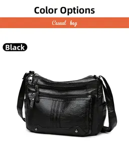 Detailed view of black soft PU leather shoulder bag with multiple functional zippers
