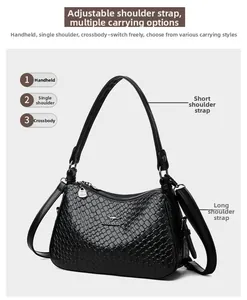 Dettaglio borsa in pelle intrecciata nera con doppie tracolle per uso a mano o tracolla