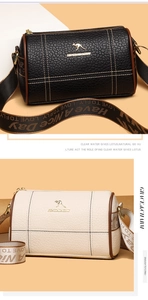 Détail de la texture cuir grainé et bandoulière jacquard sur les sacs Boston barrel