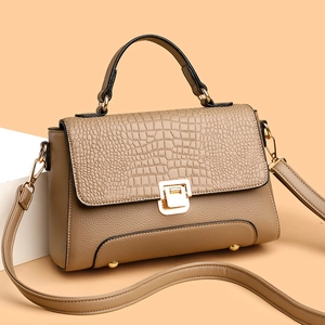 Women's khaki faux crocodile leather crossbody bag with top handle and gold buckle