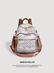 Detail of vintage wave print backpack with brown trim and gold zippers in medium size