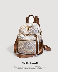 Detail of Chinese style printed backpack with blue wave patterns and brown leather accents