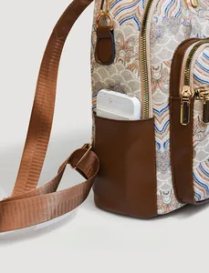 Detail of Chinese style jacquard fabric and premium leather texture on retro backpack