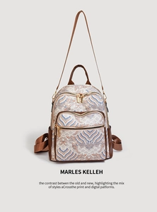 Detail of the traditional wave pattern fabric and brown leather trim on the backpack