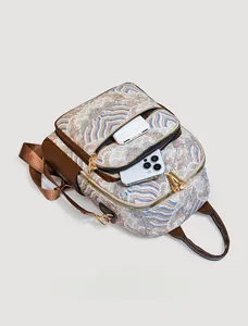 Detail view of oriental jacquard backpack holding a smartphone and power bank inside