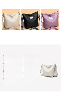 Close-up of diamond quilted crossbody bag with stylish patterned wide shoulder strap