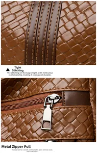 Detail of brown woven faux leather bag with precision double stitching and silver zipper