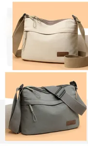 Detail view of multi-layer waterproof nylon bags in beige and grey with adjustable straps