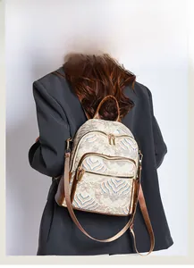 Detail view of ethnic wave print backpack featuring vintage pattern and leather strap