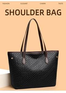 Close-up of black woven texture with brown leather straps and gold stud detail