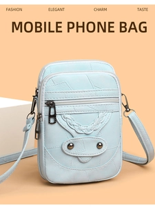 Detail of light blue PU leather phone bag with litchi texture and braided strap details