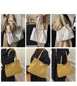 Detail view of corduroy tote bags showing thick texture and spacious interior for daily use